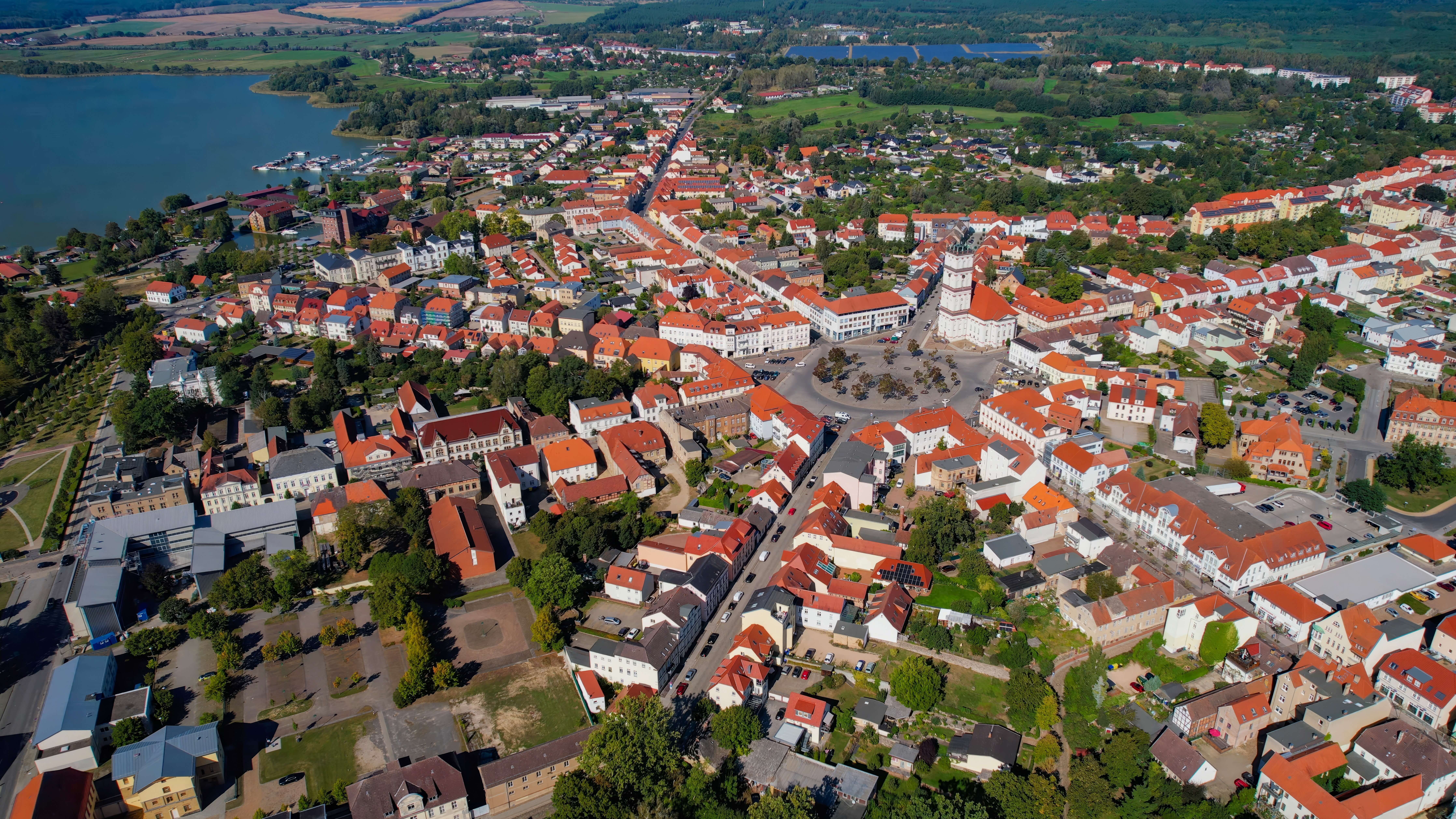 Aerial panoramic view around the old town of the city Neustrelitz on a sunny noon in summer in Germany. Aerial panoramic view around the old town of the city Neustrelitz on a sunny noon in summer in Germany.
